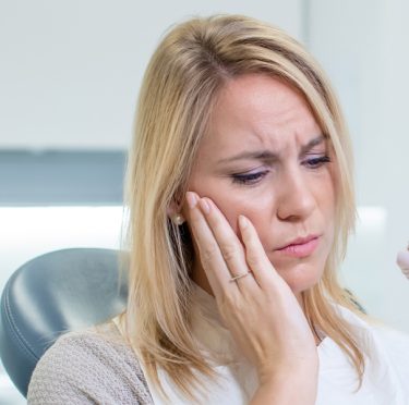 Managing Pain After a Tooth Extraction: Some Tips and Tricks